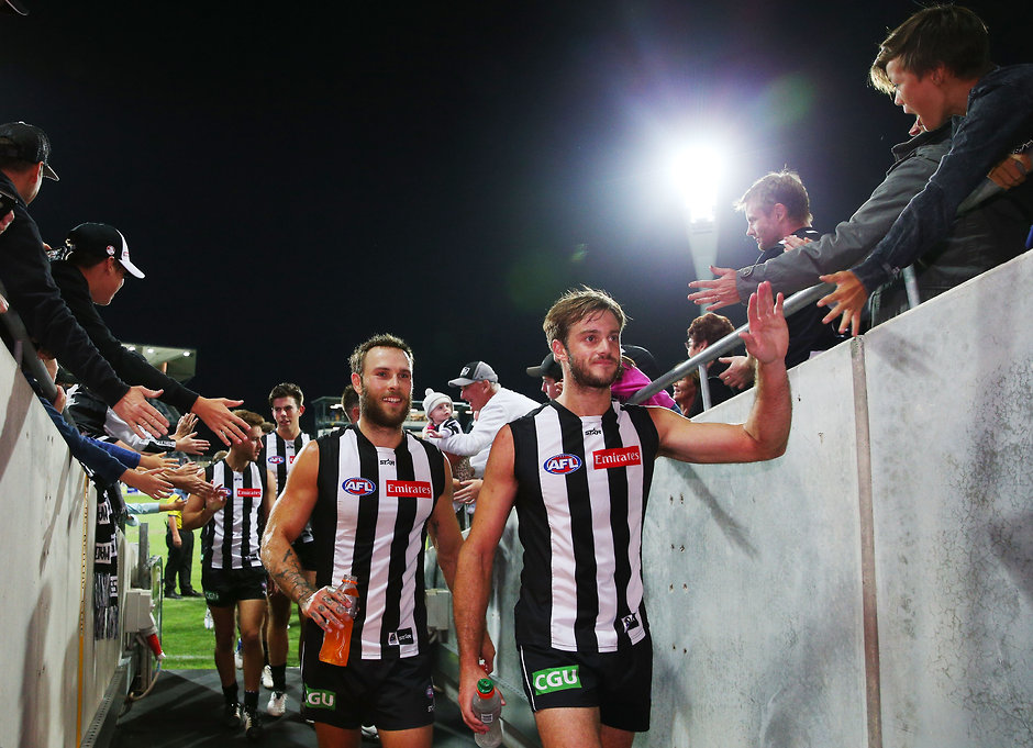 AFL 2016 NAB Challenge - Geelong v Collingwood GEELONG, AUSTRALIA - FEBRUARY 26: Brent Macaffer (L) and Alan Toovey of the Magpies celebrate the win with fans during the 2016 NAB Challenge match between the Geelong Cats and the Collingwood Magpies at Simonds Stadium, Geelong on February 26, 2016. (Photo by Michael Dodge/AFL Media)
